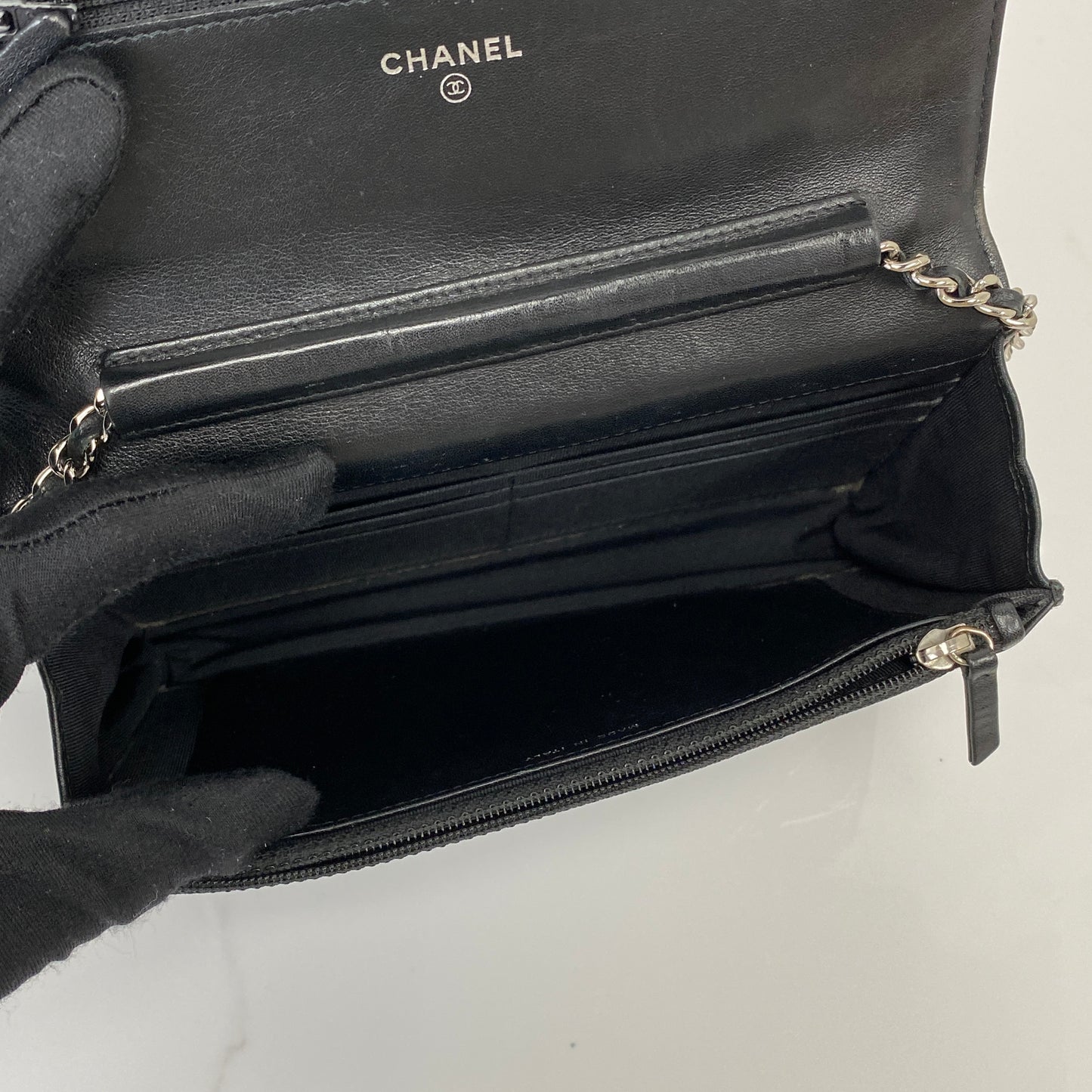 Interior of the Chanel Wallet On Chain with card slots and zip compartment