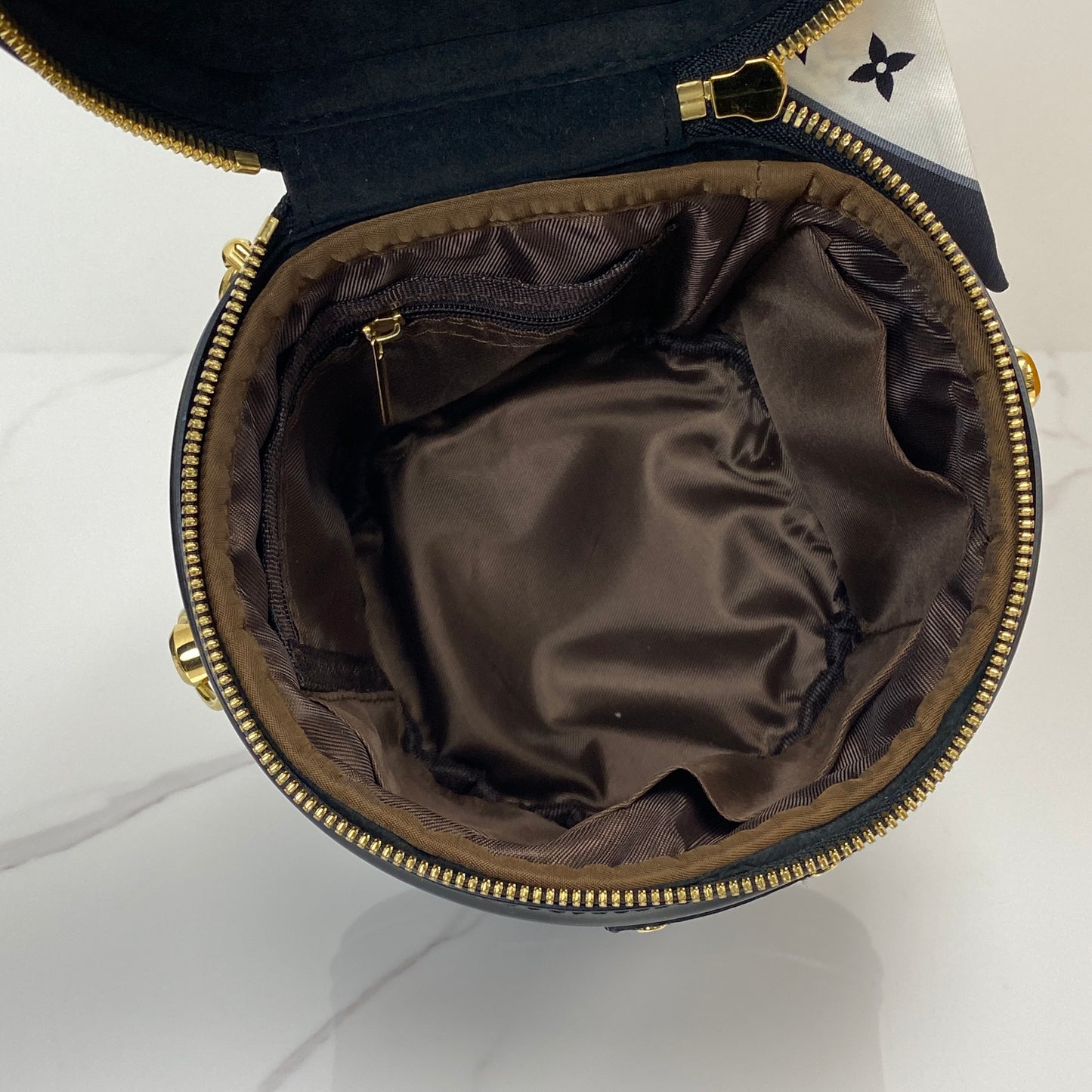 Louis Vuitton Cannes shown with its box, dustbag, lock, key and receipt