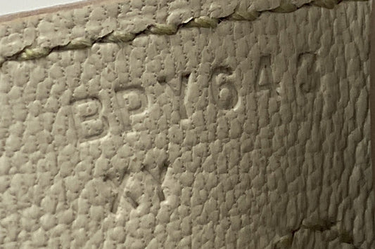 Hermès blind stamp on a Birkin 25 in Béton Epsom leather: bare letter B for 2023 beside the saddle stitching