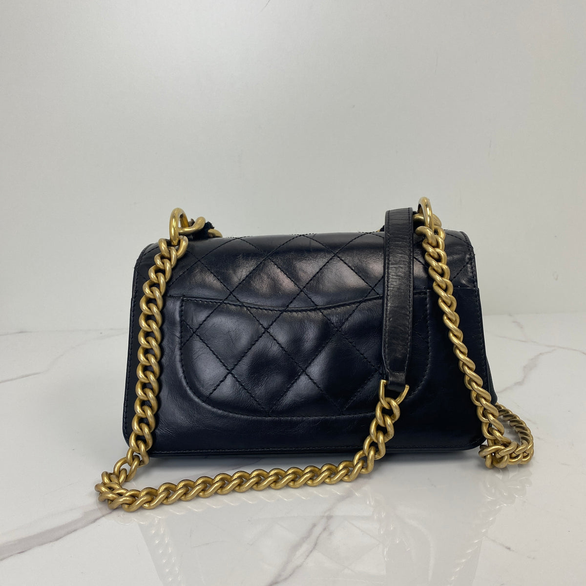 Chanel Mini classic Flap Bag, Black Calfskin, Antique Gold Tone hardware — back view