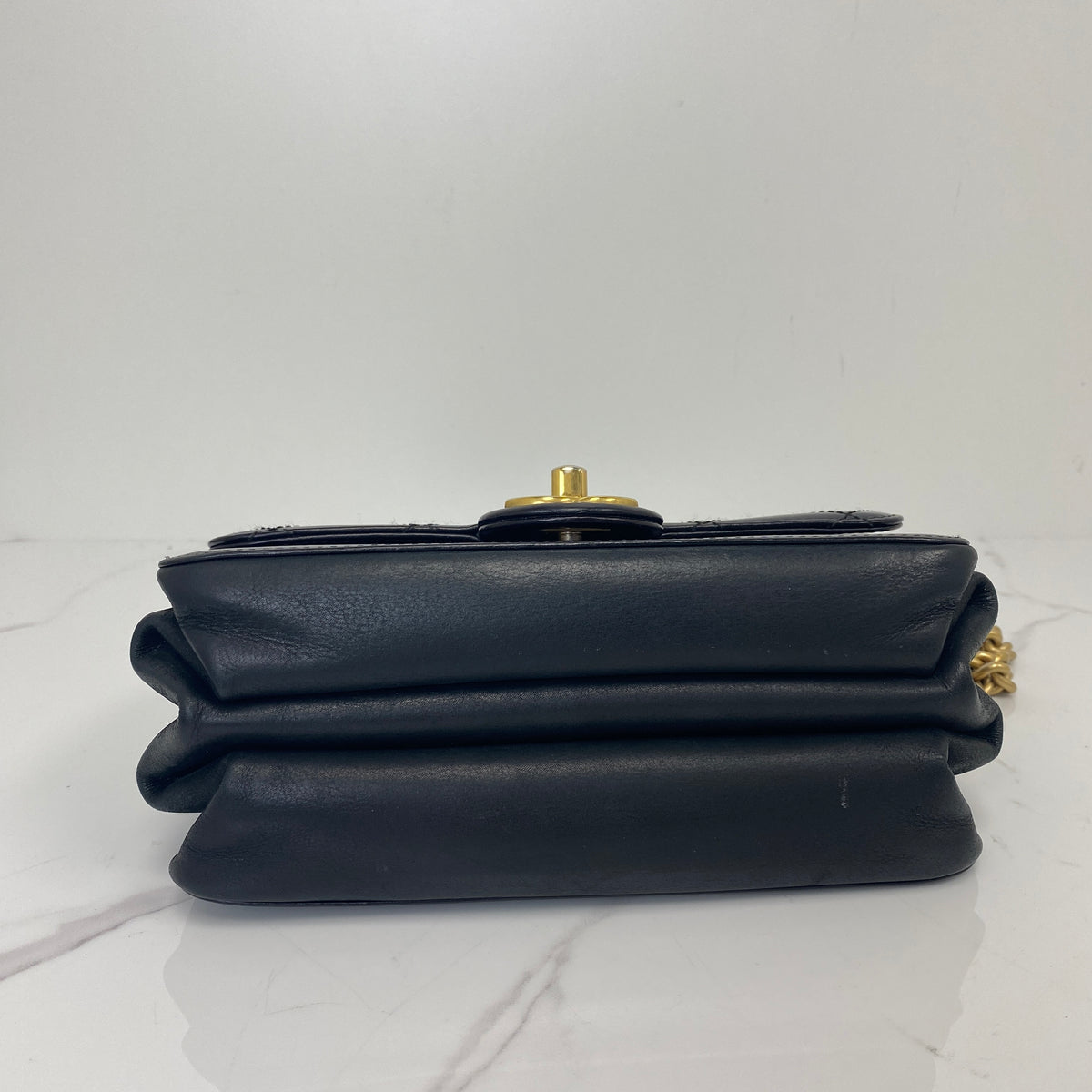 Chanel Mini classic Flap Bag, Black Calfskin, Antique Gold Tone hardware — bottom view