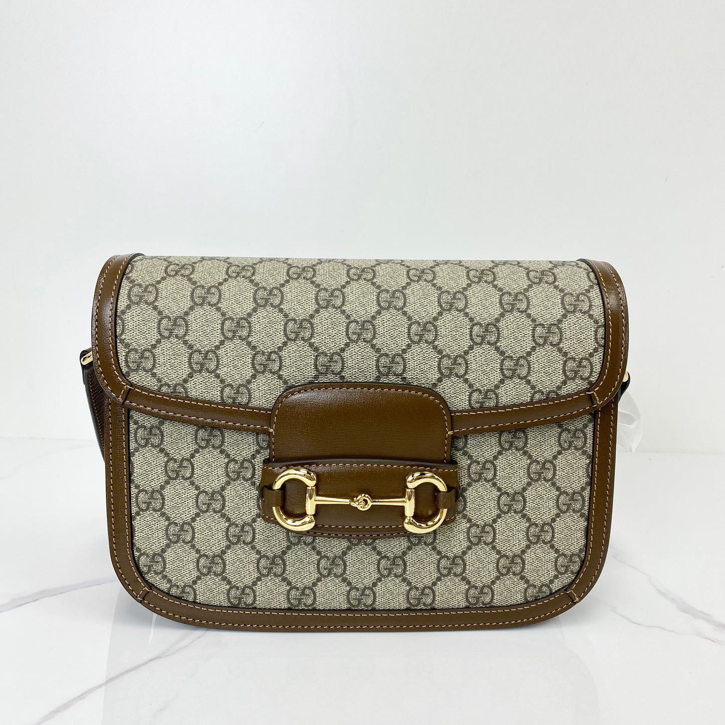 Gucci 1955 Horsebit shoulder bag in beige GG Supreme canvas with brown leather trim