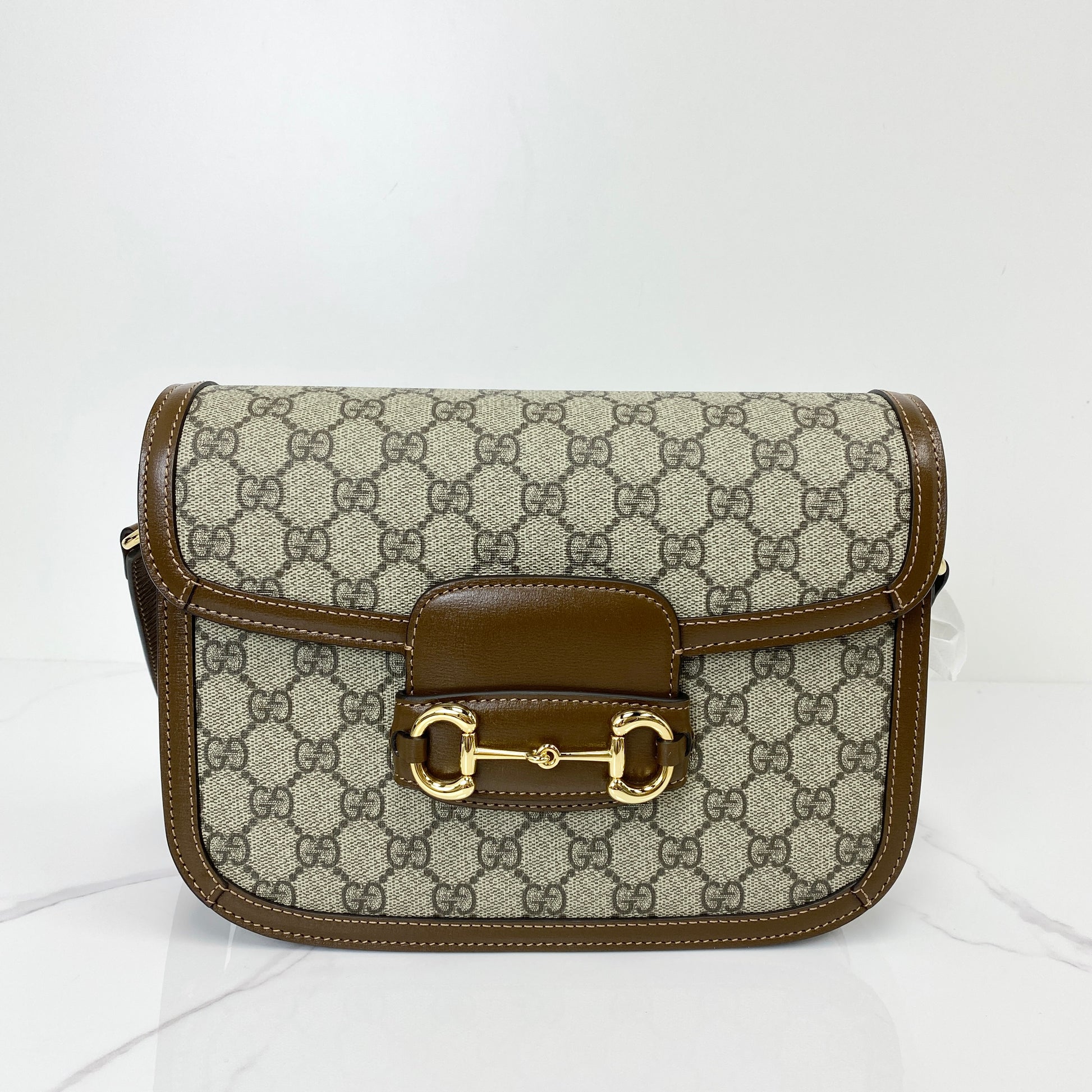 Gucci 1955 Horsebit shoulder bag in beige GG Supreme canvas with brown leather trim