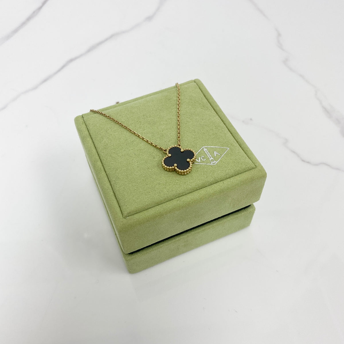 Van Cleef & Arpels Vintage Alhambra Pendant, black onyx, 18K yellow gold — front view