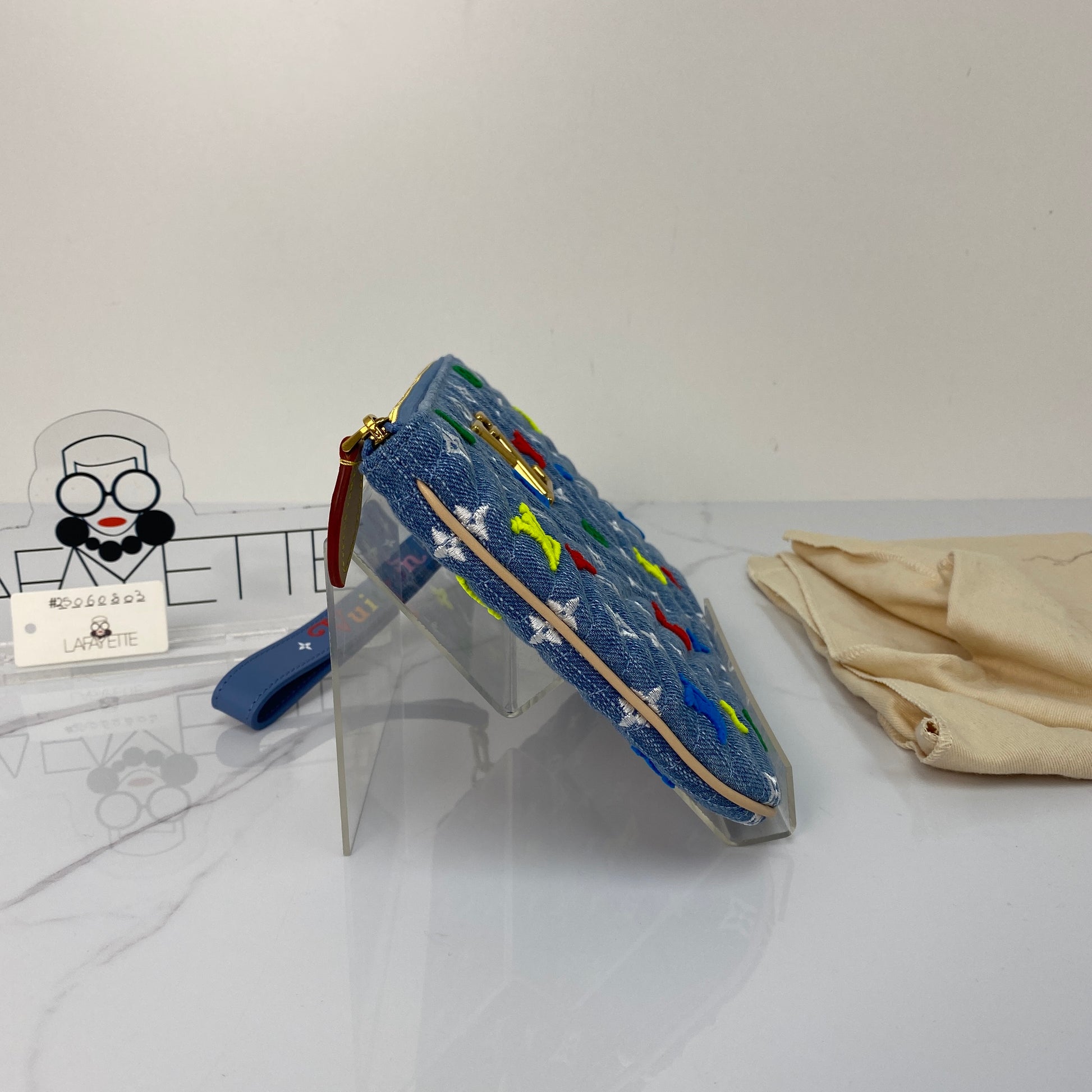 Back view of the Louis Vuitton New Wave denim pouch