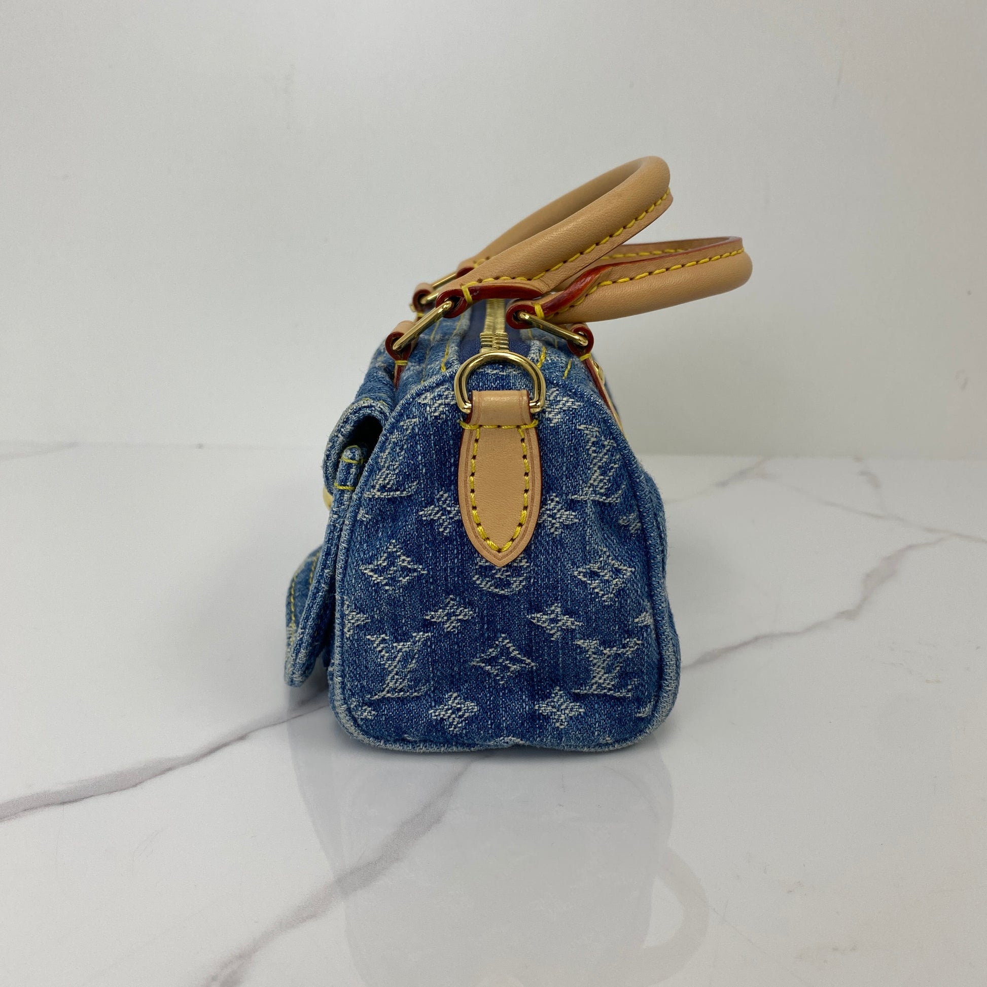 Side view of the Louis Vuitton Monogram Denim Nano Speedy