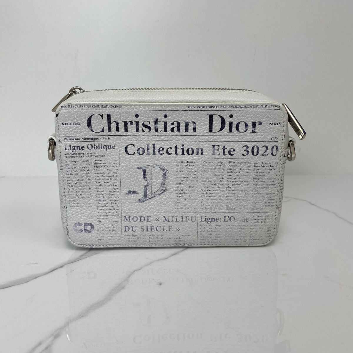 Christian Dior x Daniel Arsham Newspaper Messenger Bag, white and black newspaper-print calfskin, silver-tone hardware — detail view 3