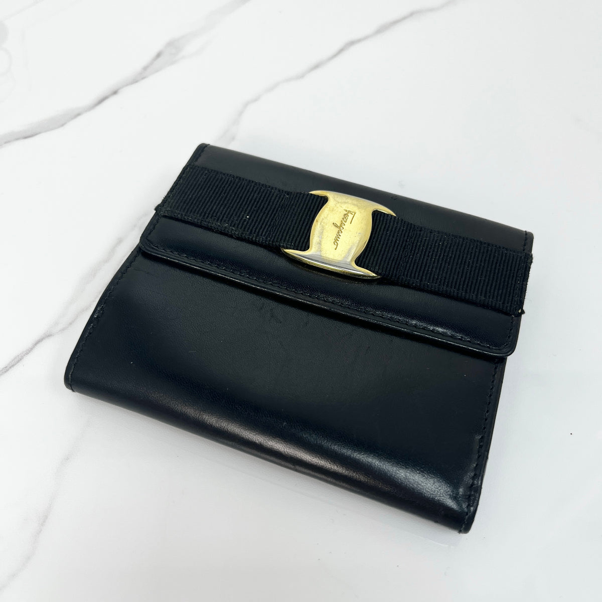 Salvatore Ferragamo Vara Bow Wallet, black calfskin, antique gold-tone Vara bow — front view