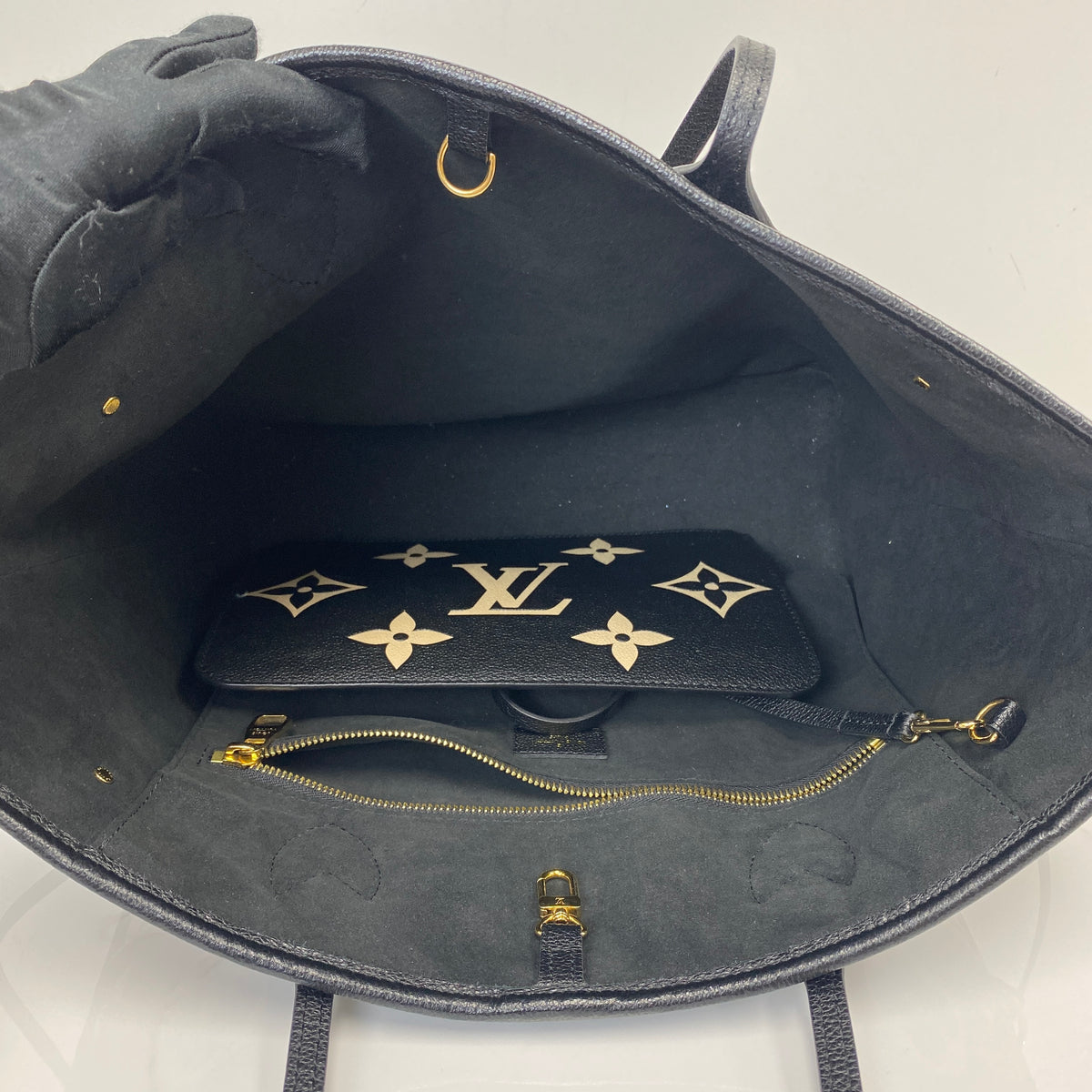 Louis Vuitton Neverfull MM, black Monogram Empreinte leather, gold-tone hardware — detail view 4