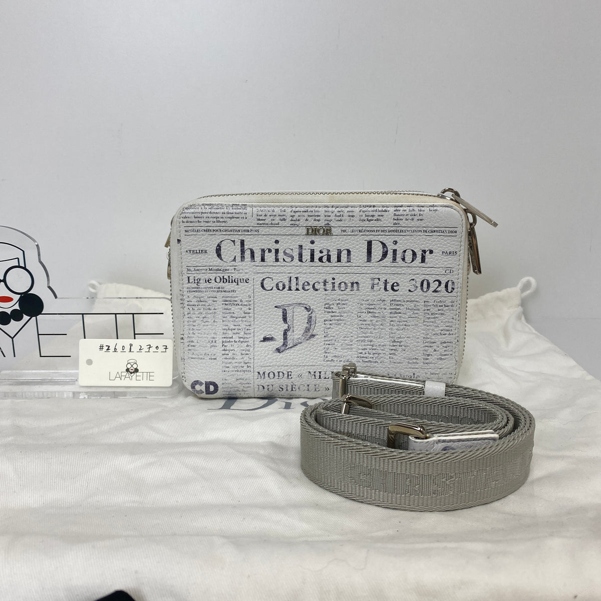 Christian Dior x Daniel Arsham Newspaper Messenger Bag, white and black newspaper-print calfskin, silver-tone hardware — detail view 1
