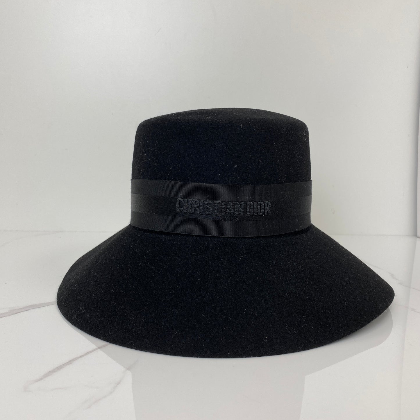 Front view of the black Dior D-Tulipe cloche hat