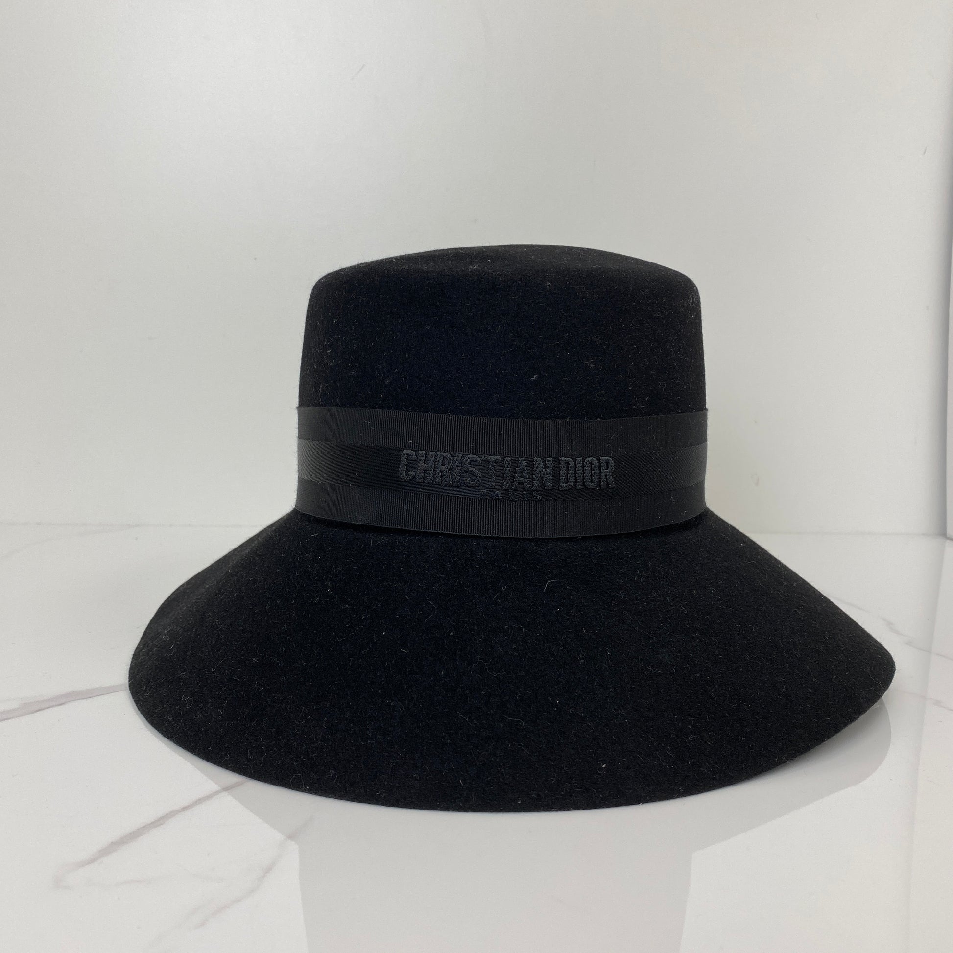 Front view of the black Dior D-Tulipe cloche hat