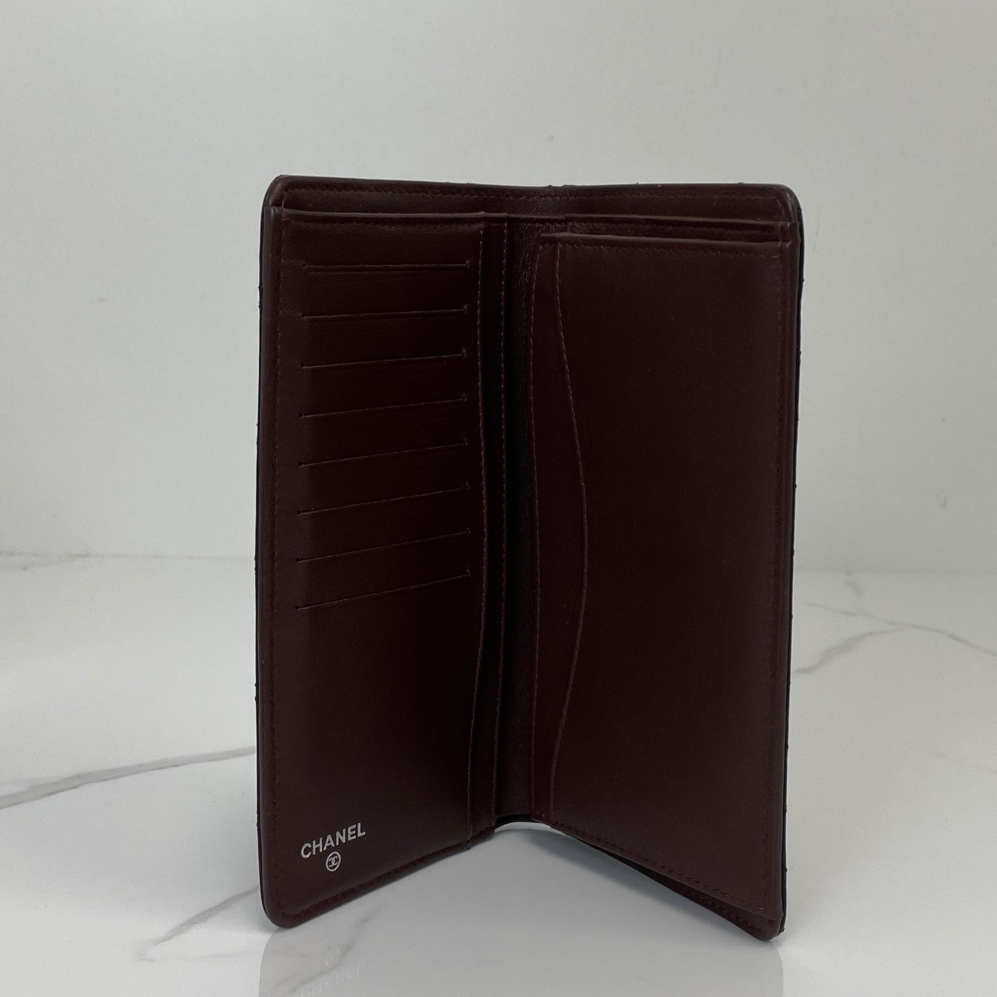 Chanel long flap wallet shown with its box, card and receipt