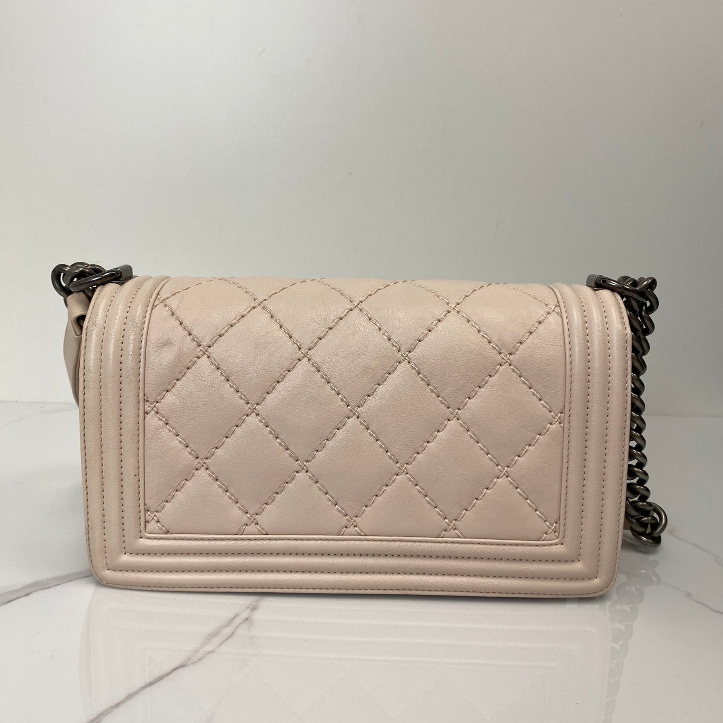 Side profile of the Chanel Boy Bag in pink calfskin
