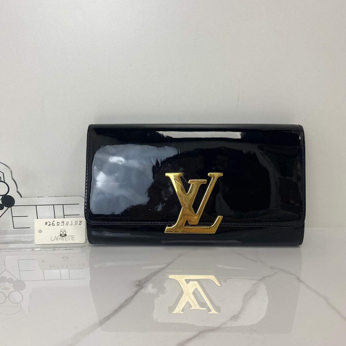 Louis Vuitton Louise Patent Leather Clutch Bag, black patent leather, gold-tone LV clasp — detail view 1