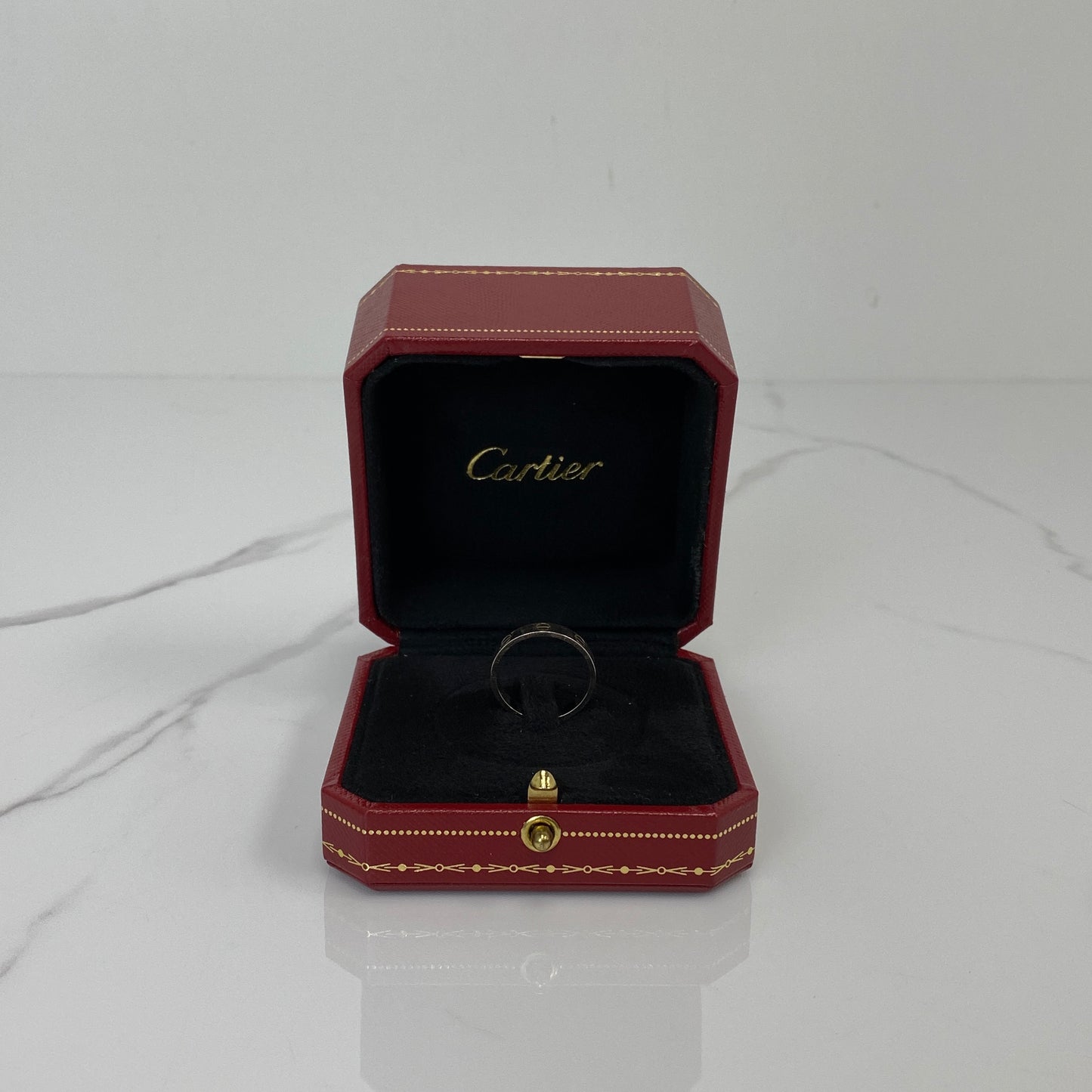Side view of the Cartier Love Ring in white gold