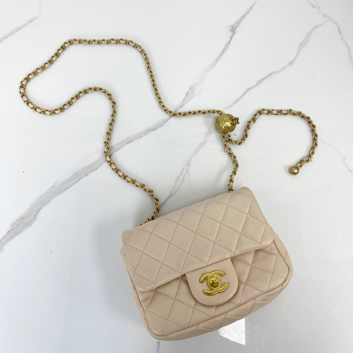 Chanel Mini Classic Flap with Pearl Crush, pink lambskin, antique gold-tone hardware, pearl chain — front view