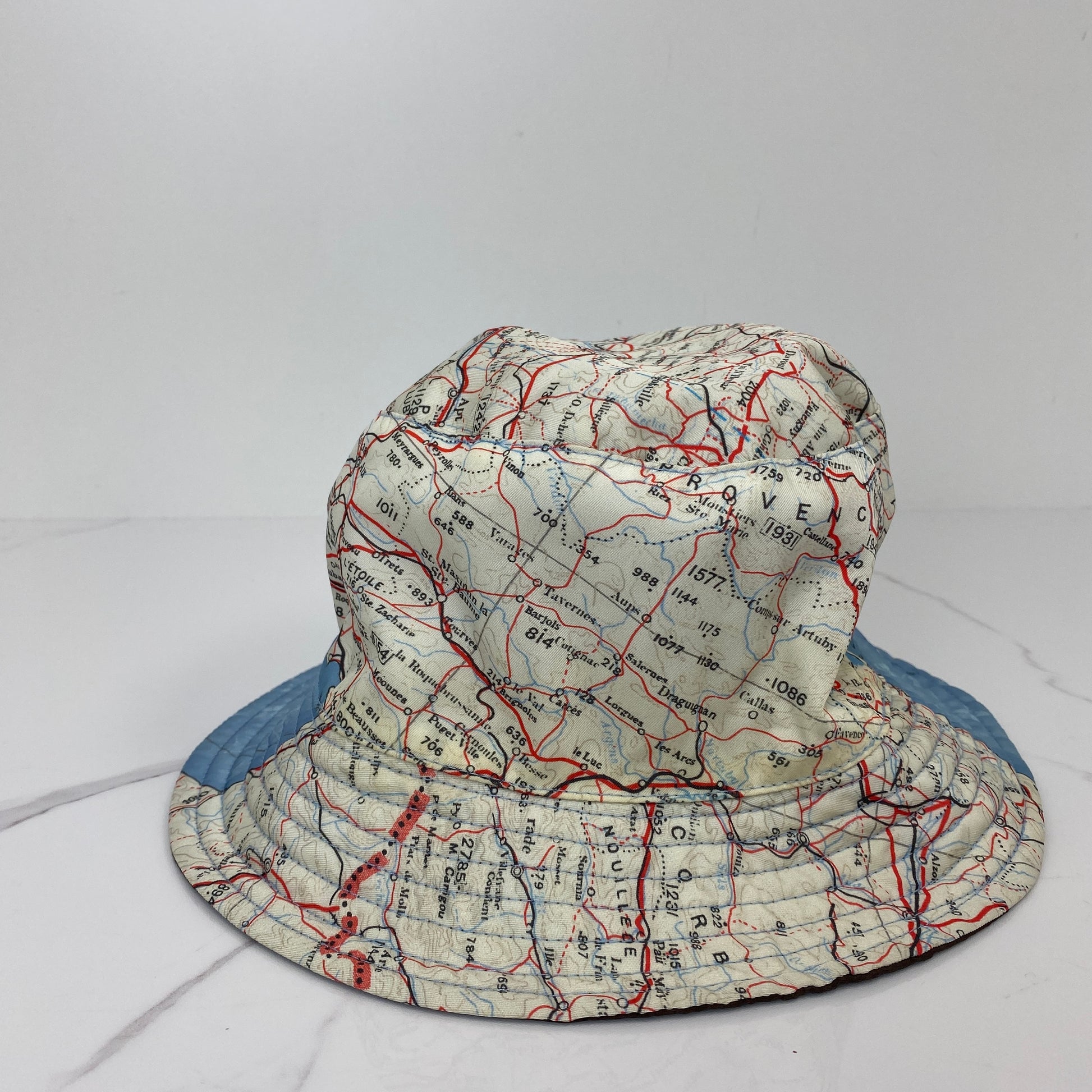 Detail of the map print on the Louis Vuitton hat