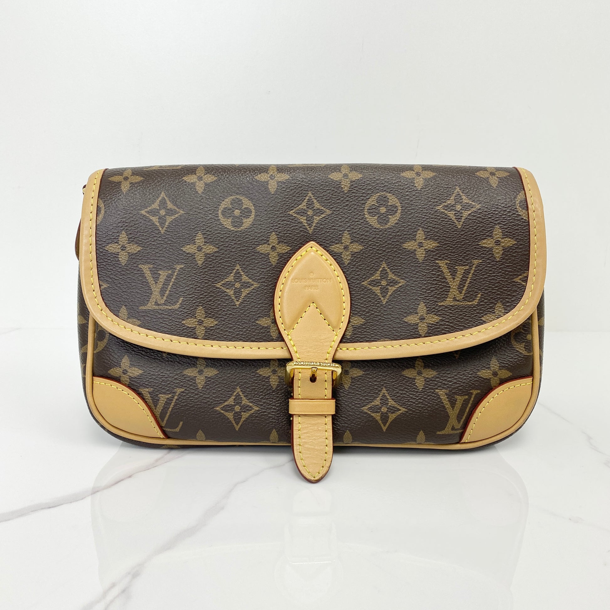 Louis Vuitton Diane in Monogram coated canvas with vachetta leather buckle flap