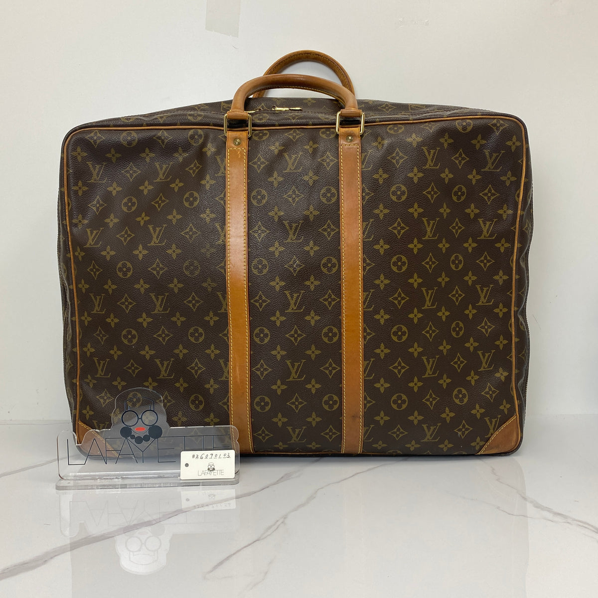 Louis Vuitton Monogram Sirius 55 Vintage Luggage Bag, brown Monogram canvas, Vachetta trim — detail view 1