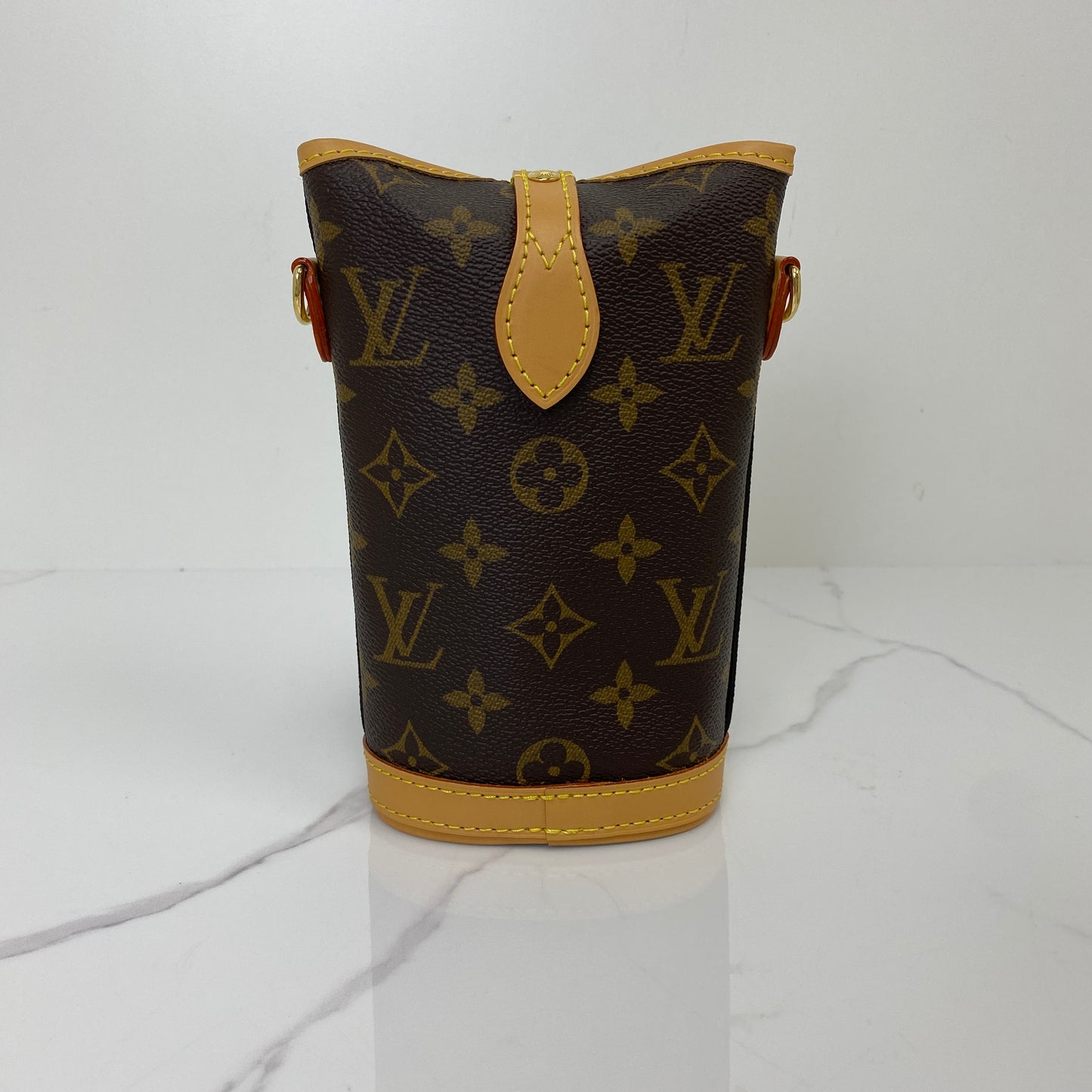 Front view of the Louis Vuitton Fold Me Pouch showing the Monogram canvas and vachetta flap