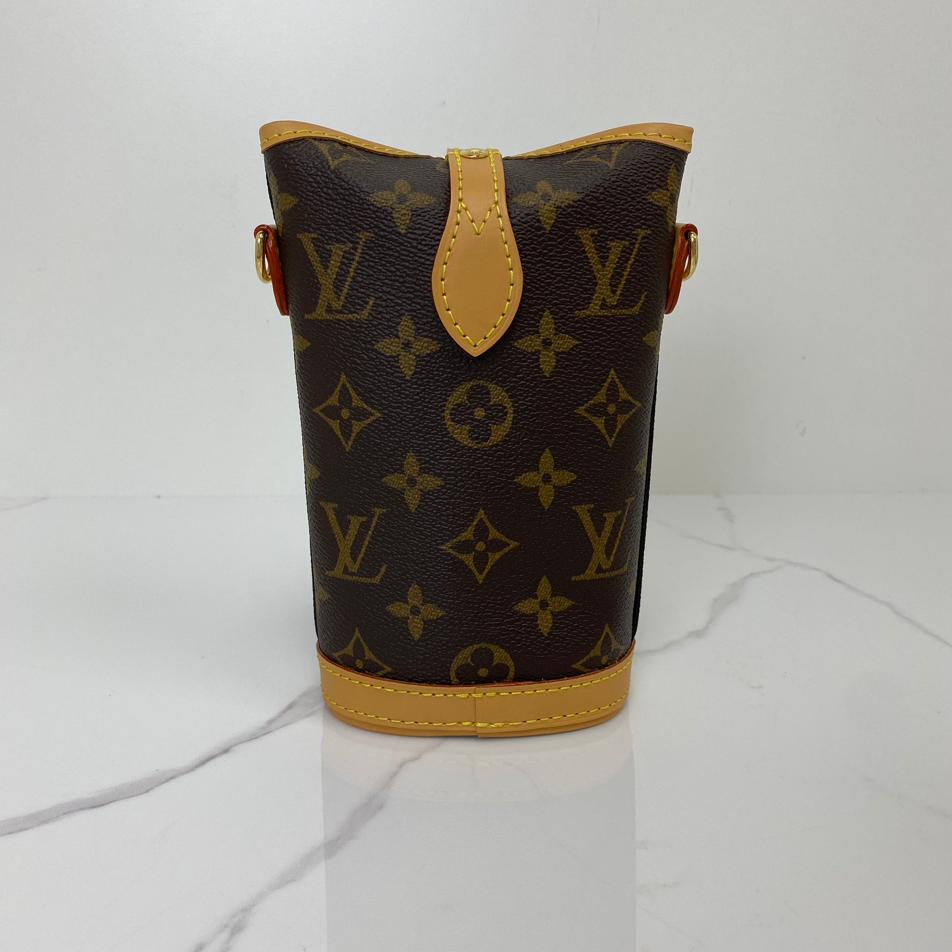 Front view of the Louis Vuitton Fold Me Pouch showing the Monogram canvas and vachetta flap