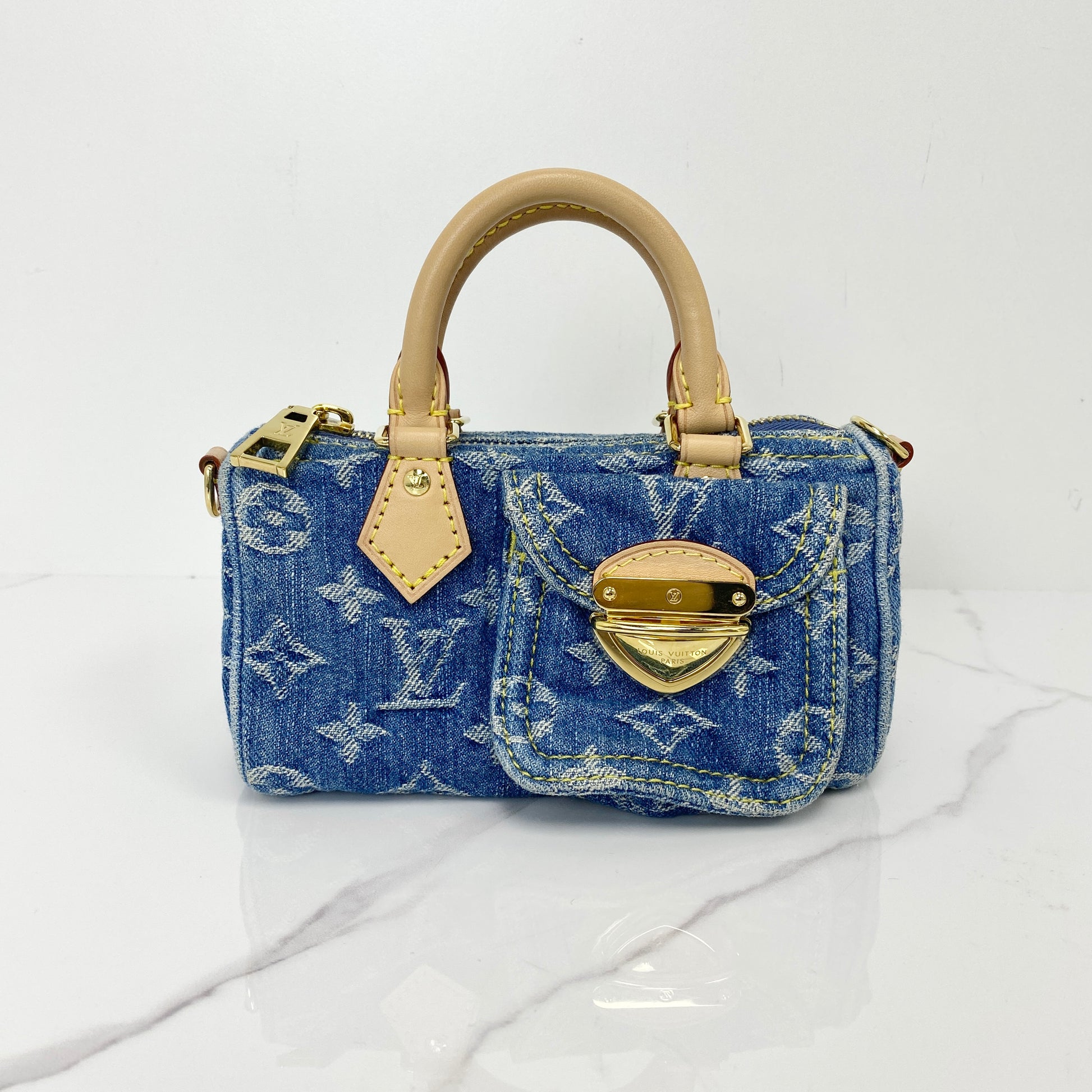 Louis Vuitton Monogram Denim Nano Speedy in blue with leather top handles and front pocket