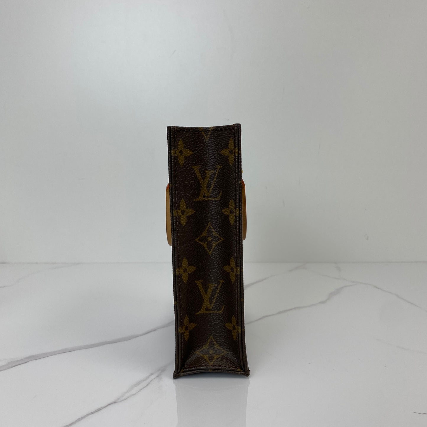 Base of the LV Petit Sac Plat in Monogram canvas