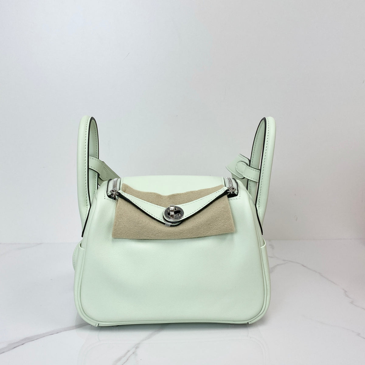Hermès Sac Mini Lindy, pale green Swift calfskin, palladium hardware — front view