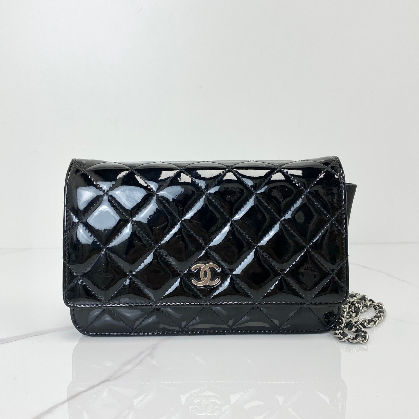 Chanel Classic Wallet On Chain in black patent quilted calfskin with silver chain