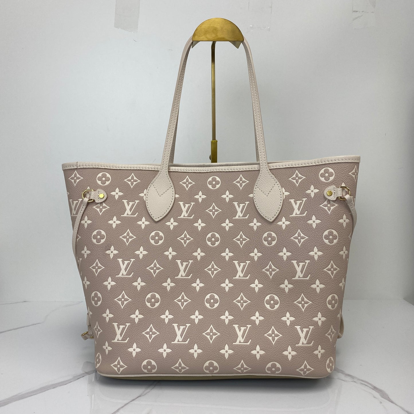 Front view of the Louis Vuitton Neverfull MM showing the embossed Monogram pattern