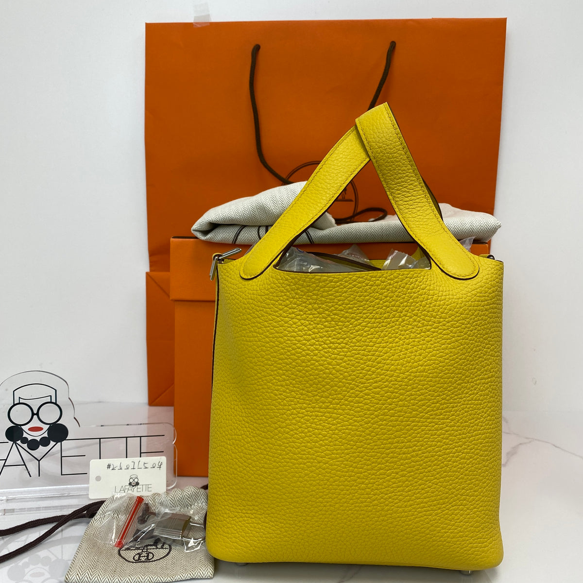 Hermès Picotin Lock 18, Sun yellow Clemence leather, palladium hardware — detail view 1
