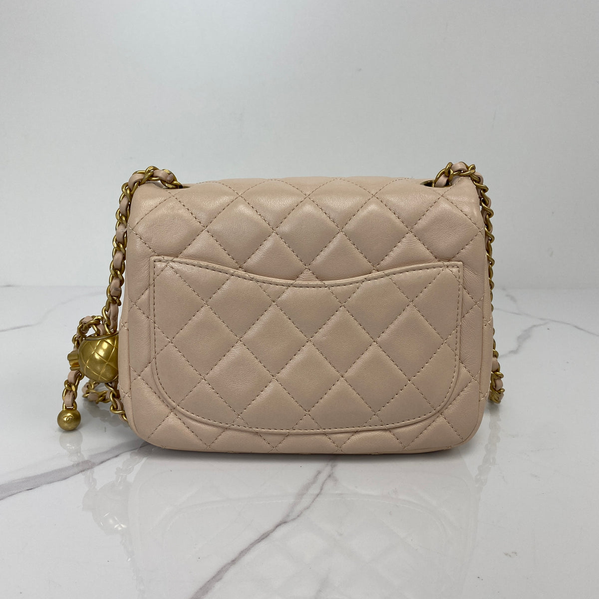Chanel Mini Classic Flap with Pearl Crush, pink lambskin, antique gold-tone hardware, pearl chain — detail view 3