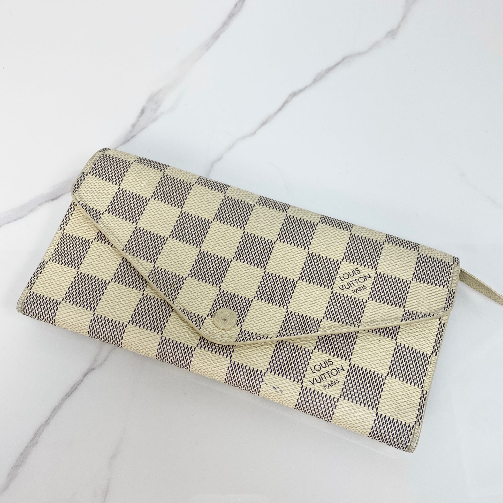 Louis Vuitton Sarah Wallet in white coated canvas with gold-tone hardware