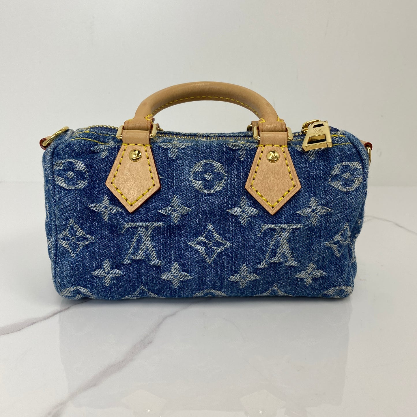 Back view of the Louis Vuitton Nano Speedy in Monogram denim