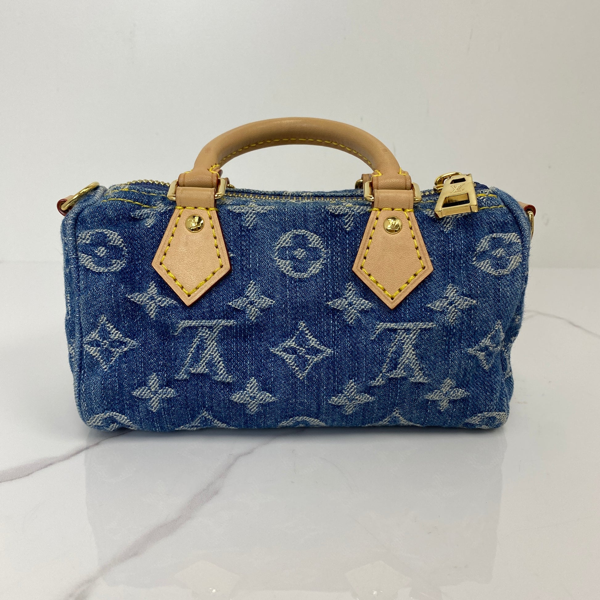 Back view of the Louis Vuitton Nano Speedy in Monogram denim