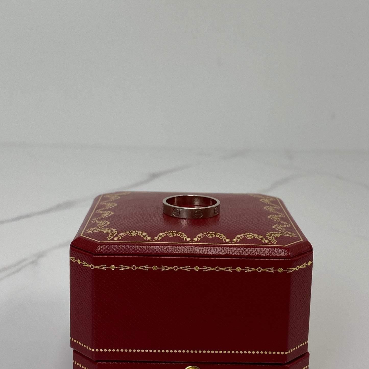 Cartier Love Ring shown with its box and certificate