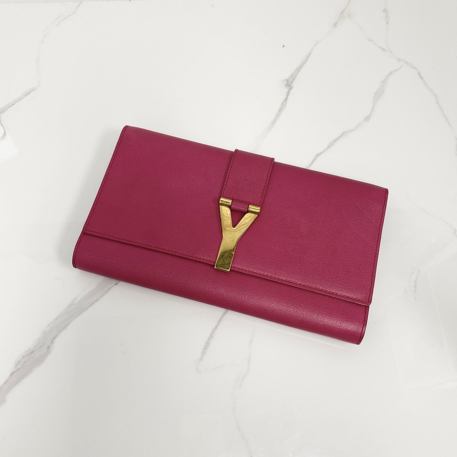 Saint Laurent Y Ligne Clutch, fuchsia pink calfskin, gold-tone Y closure — front view