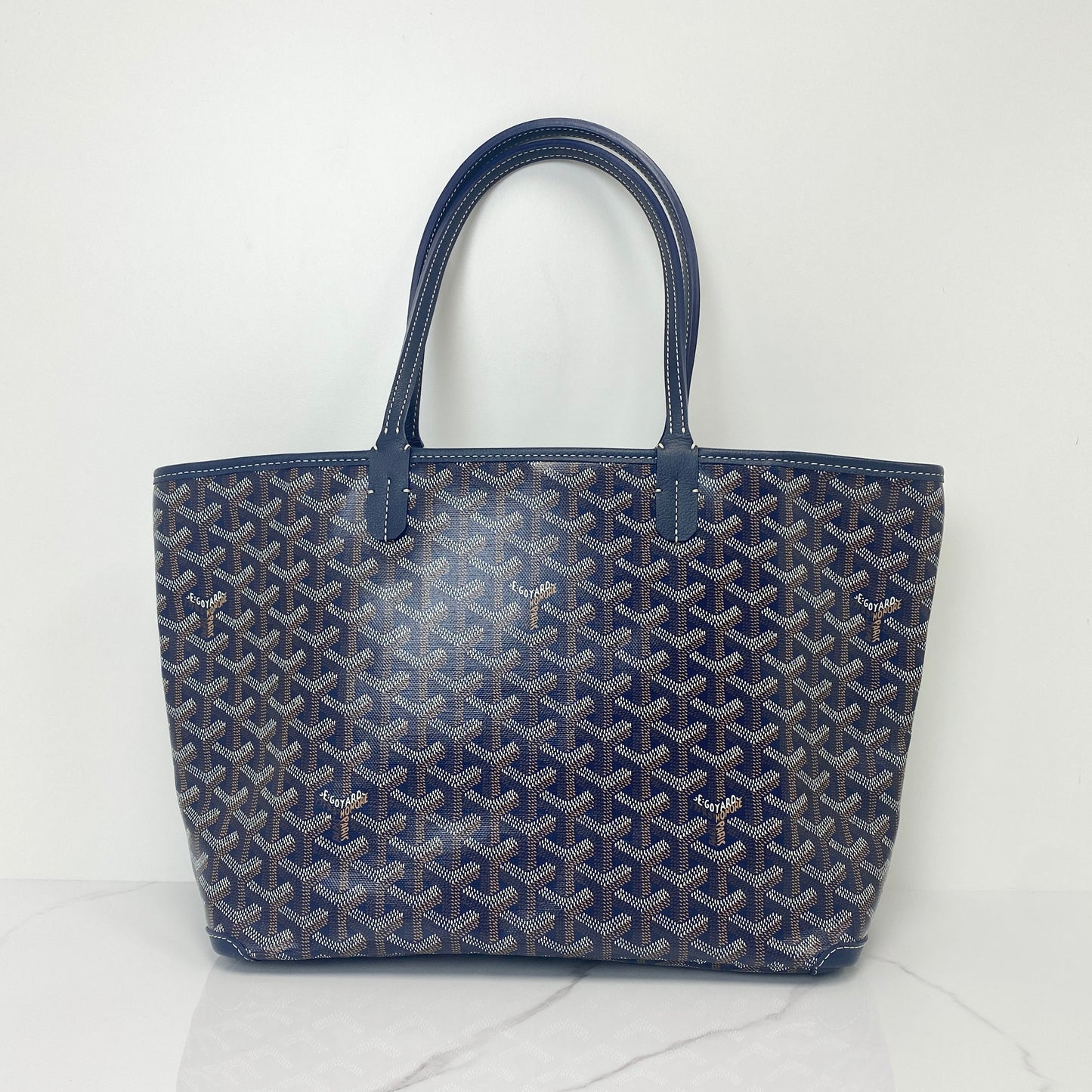 Goyard Artois PM tote in navy Goyardine canvas with leather handles and trim