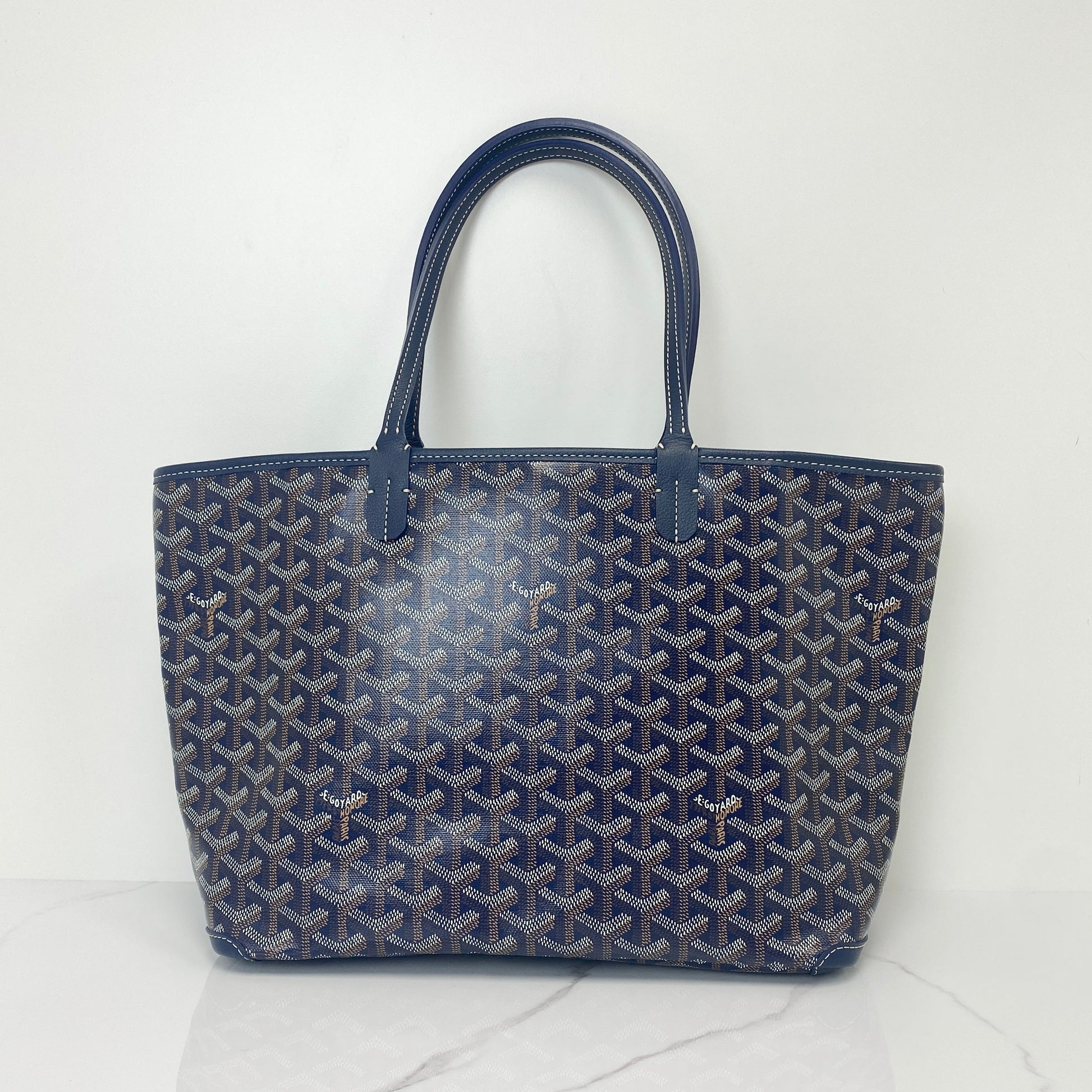 Goyard Artois PM tote in navy Goyardine canvas with leather handles and trim