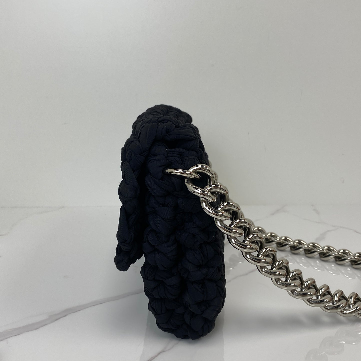 Front view of the black tweed Chanel flap bag