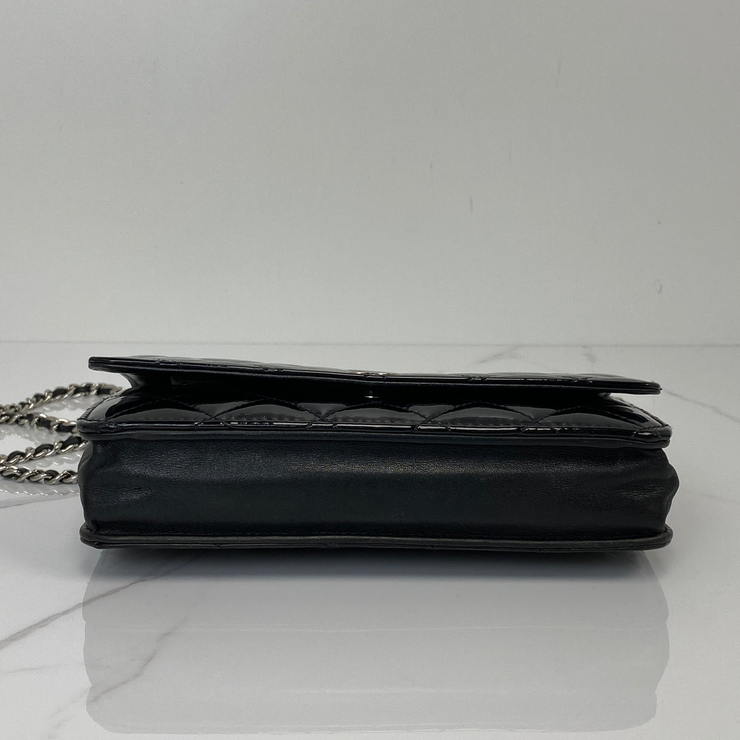 Base of the Chanel Wallet On Chain in black patent calfskin