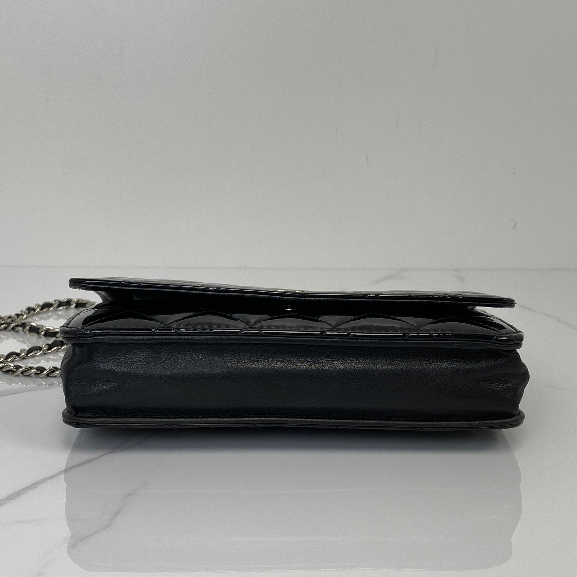 Base of the Chanel Wallet On Chain in black patent calfskin
