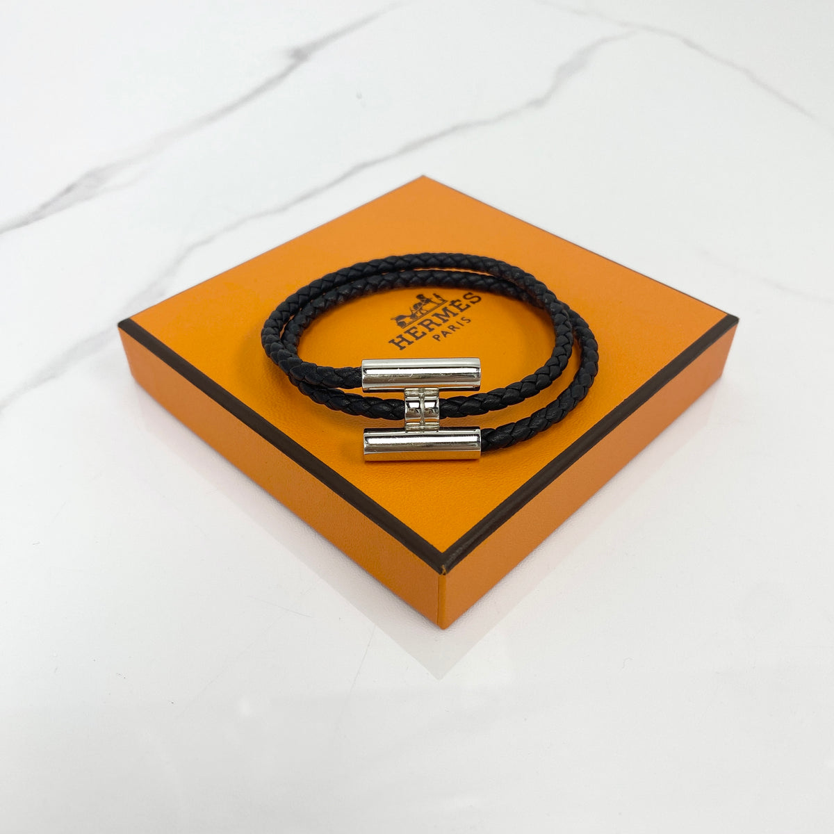Hermès Tournis Tressé Bracelet in Noir Swift calfskin with silver hardware
