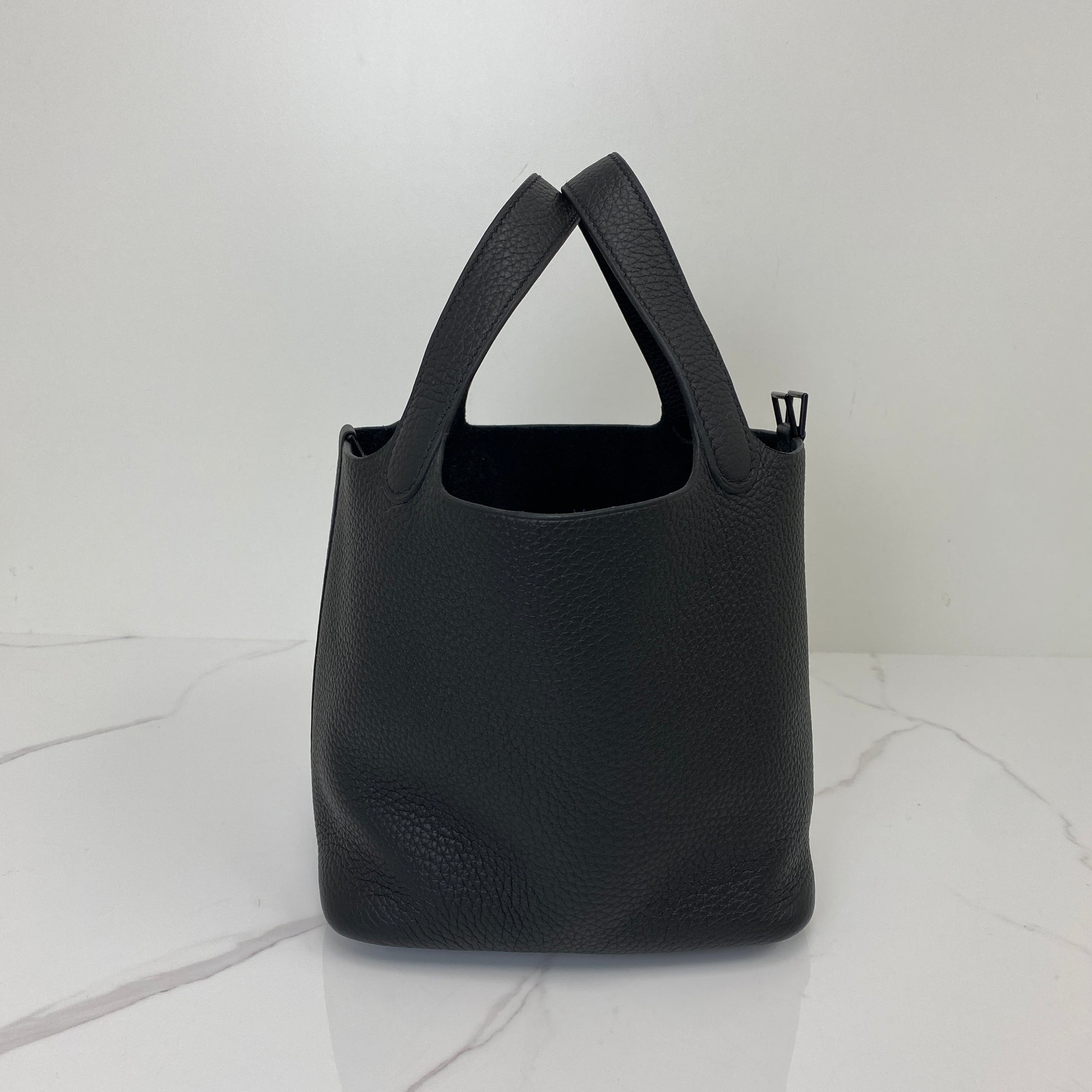 Angled view of the Hermès Picotin 18 with its open bucket top and handles