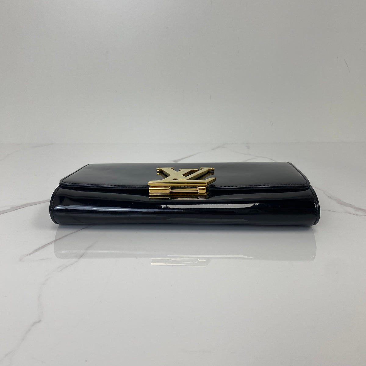Louis Vuitton Louise Patent Leather Clutch Bag, black patent leather, gold-tone LV clasp — detail view 4