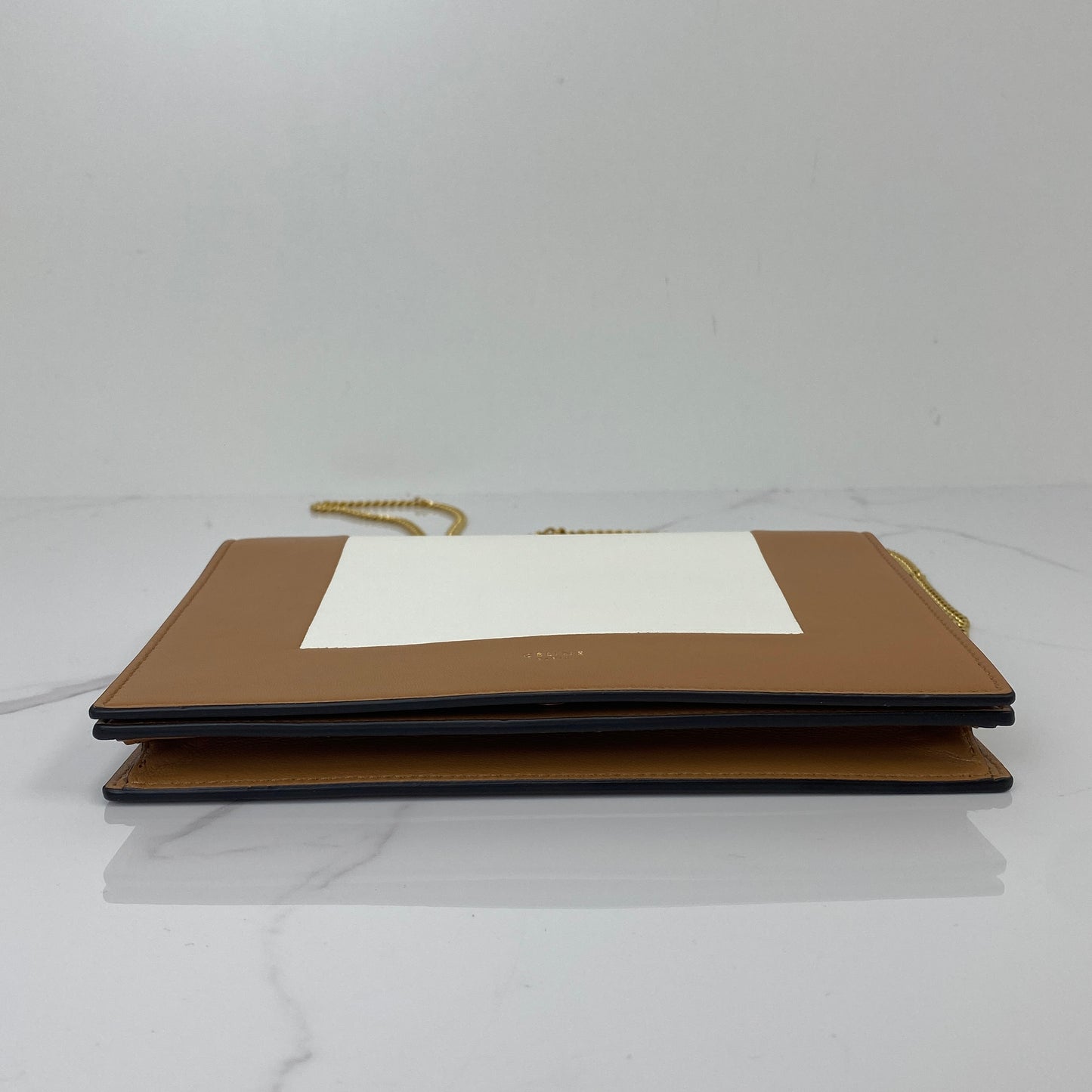 Front view of the Celine Pocket Envelope wallet on chain