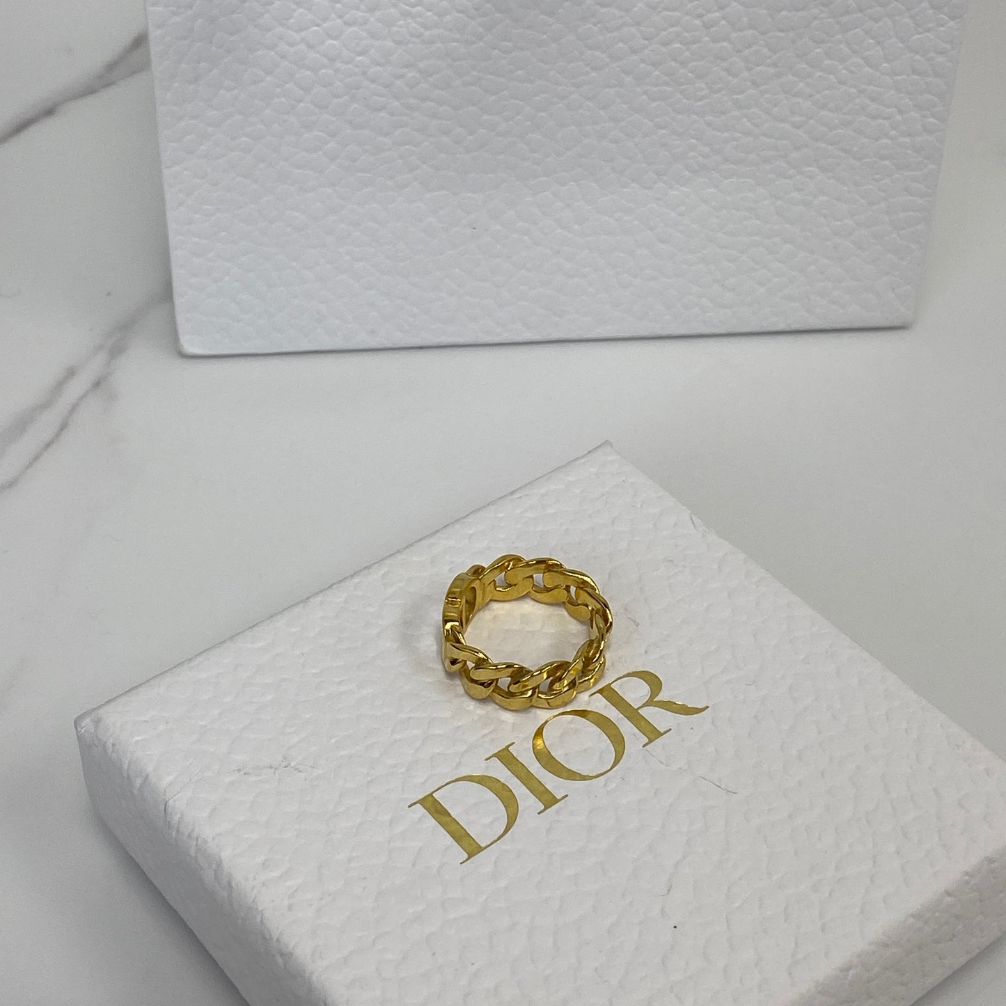 Dior CD Icon ring shown with its box, dustbag and receipt