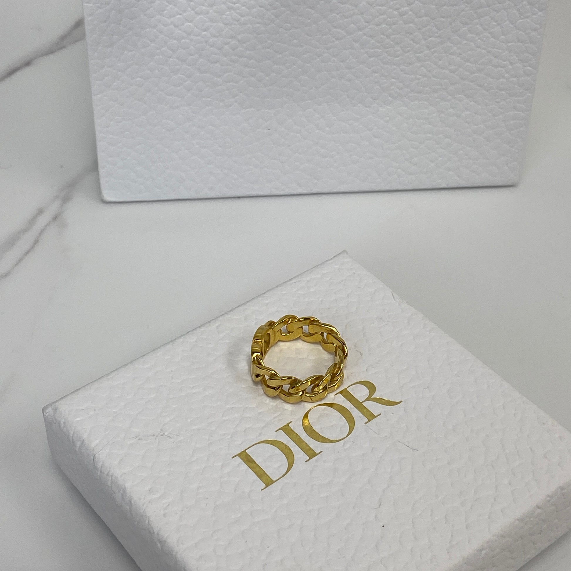 Dior CD Icon ring shown with its box, dustbag and receipt