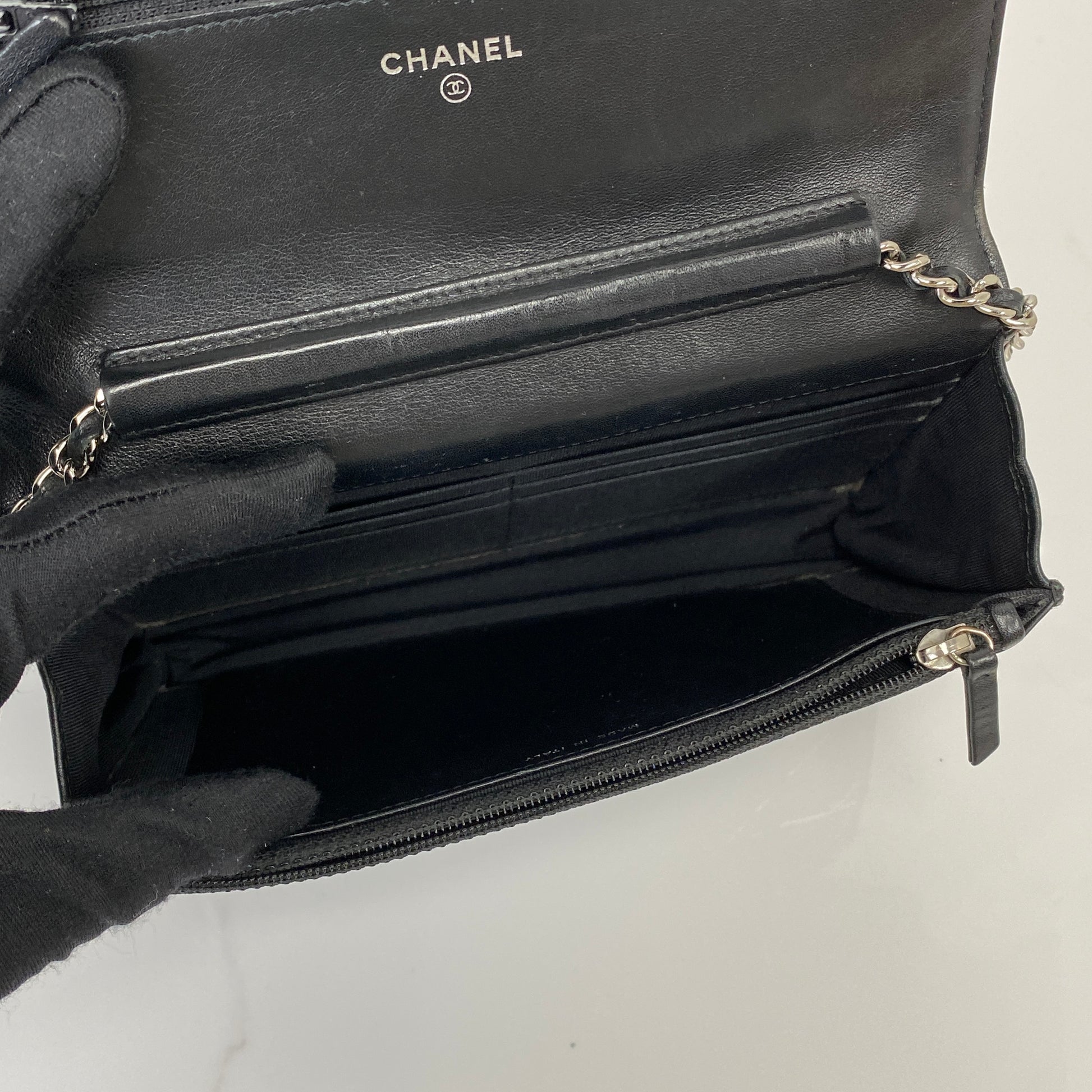 Interior of the Chanel Wallet On Chain with card slots and zip compartment